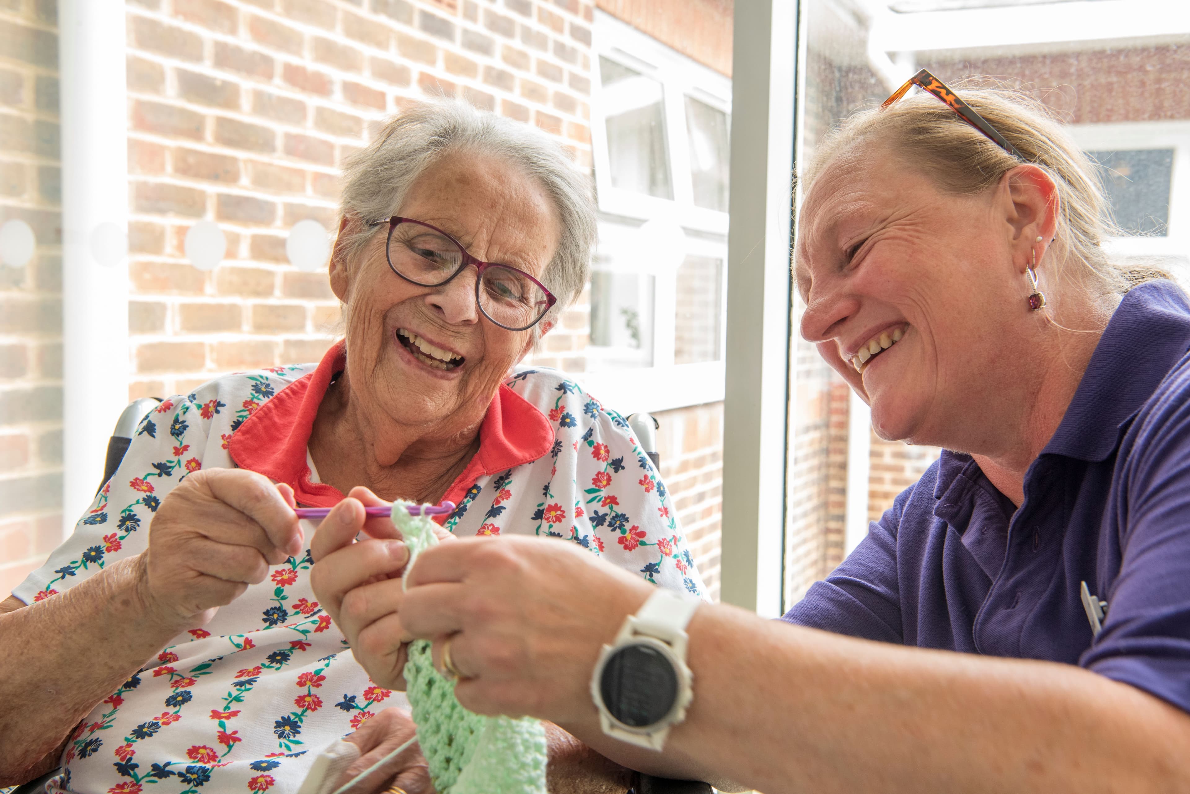 Resident and carer at Alton Nursing Home, Alton, Hampshire