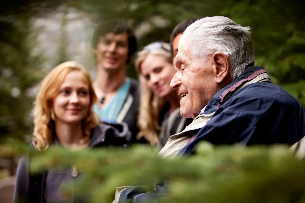 A family spending time with their grandparent