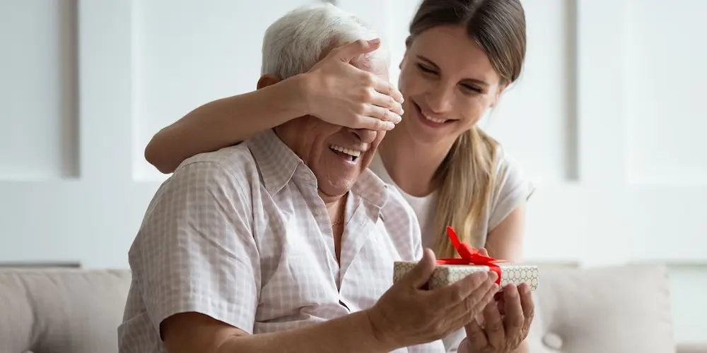 An old man receiving a gift