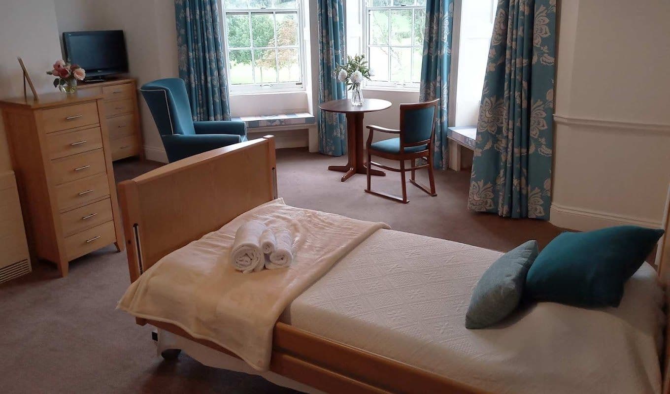 Bedroom of Kenwith Castle care home in Bideford, Devon