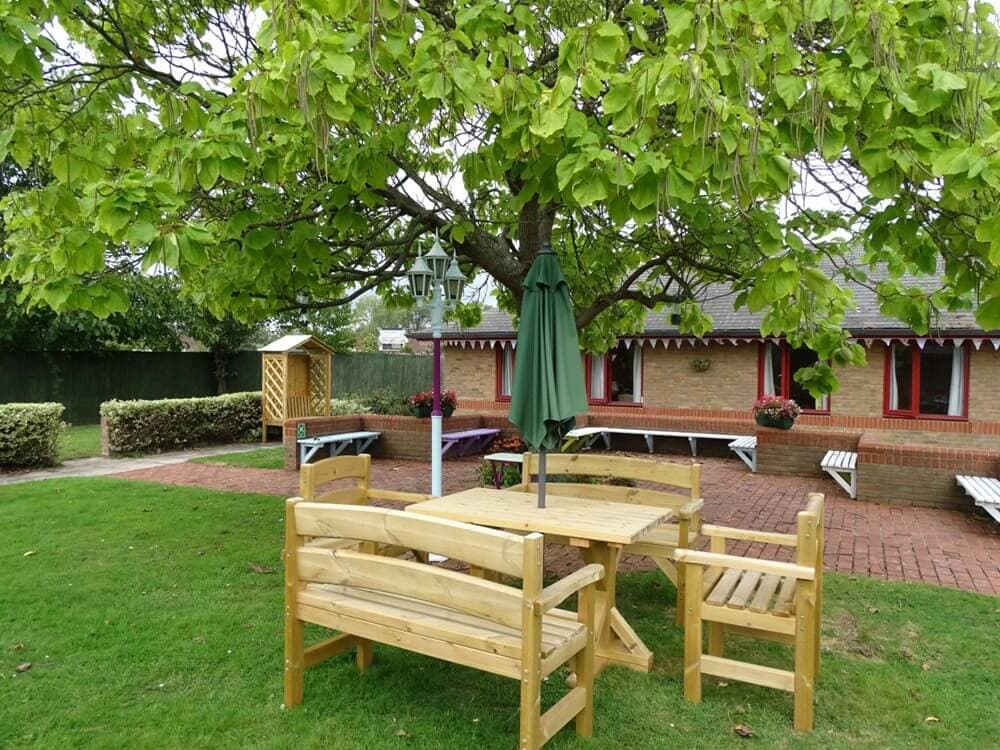 Garden area of Echelforde care home in Ashford, Surrey