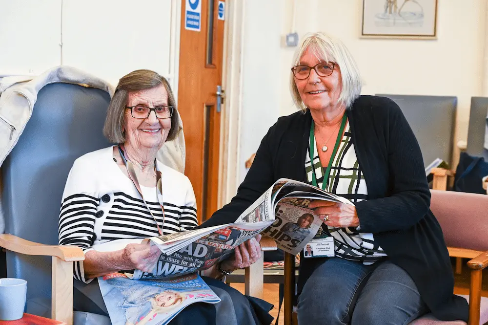 Elderly woman with a female carer