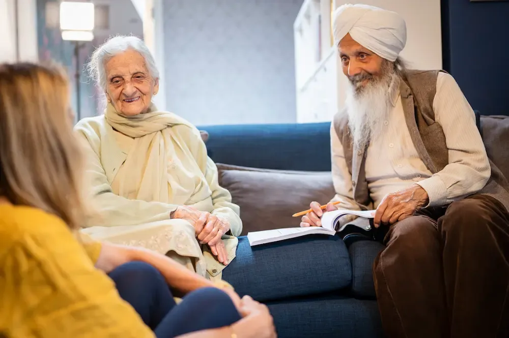 Female carer with older married couple