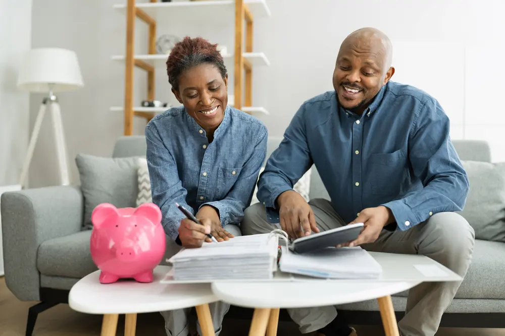 Happy couple opening a savings account together