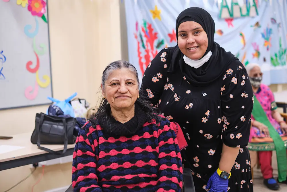 Mother and daughter carer smiling