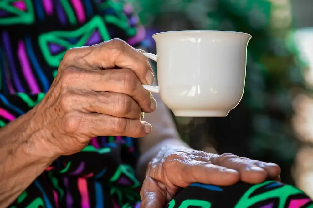 Older adult drinking tea