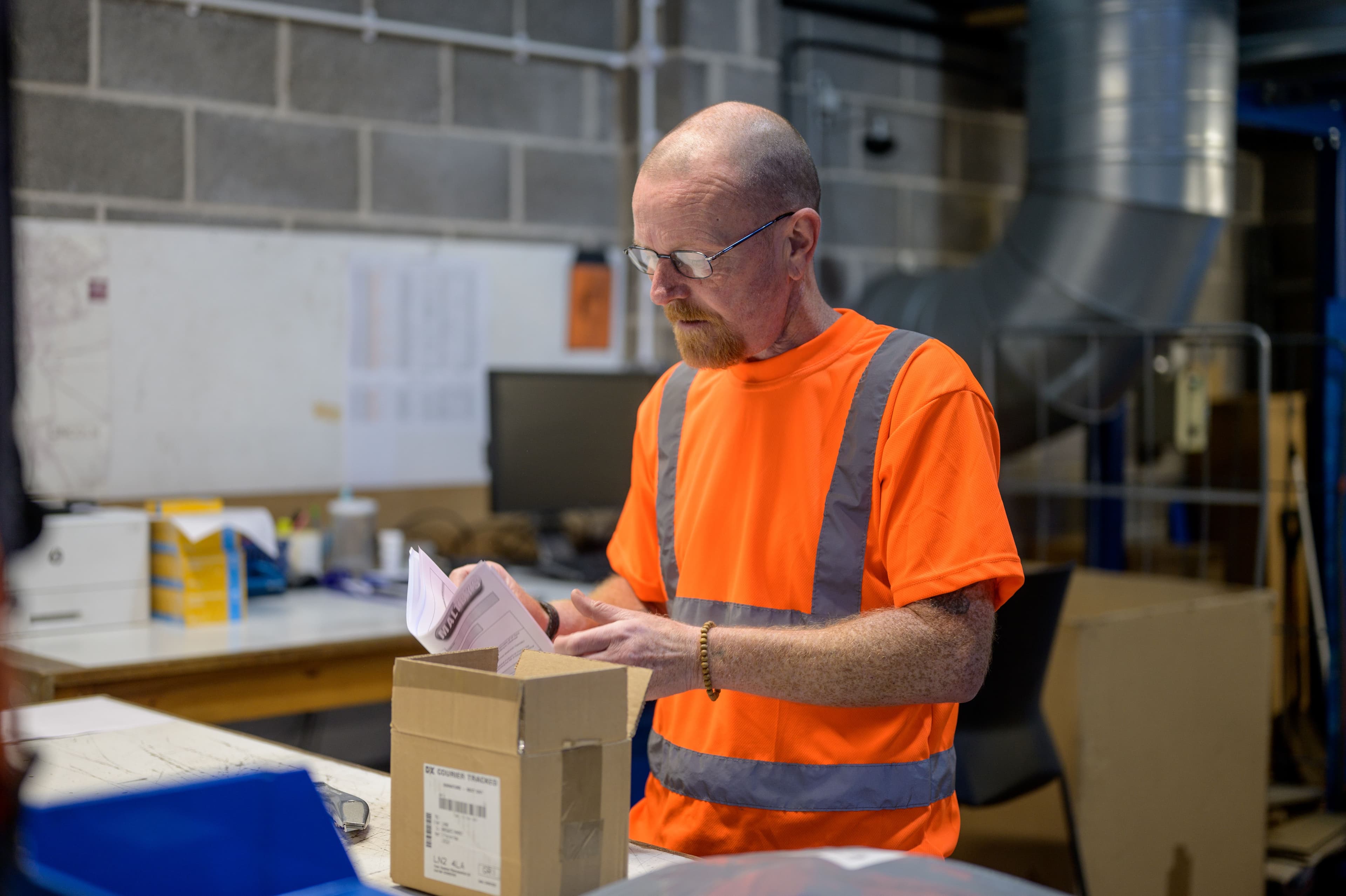 Older man working in a factory