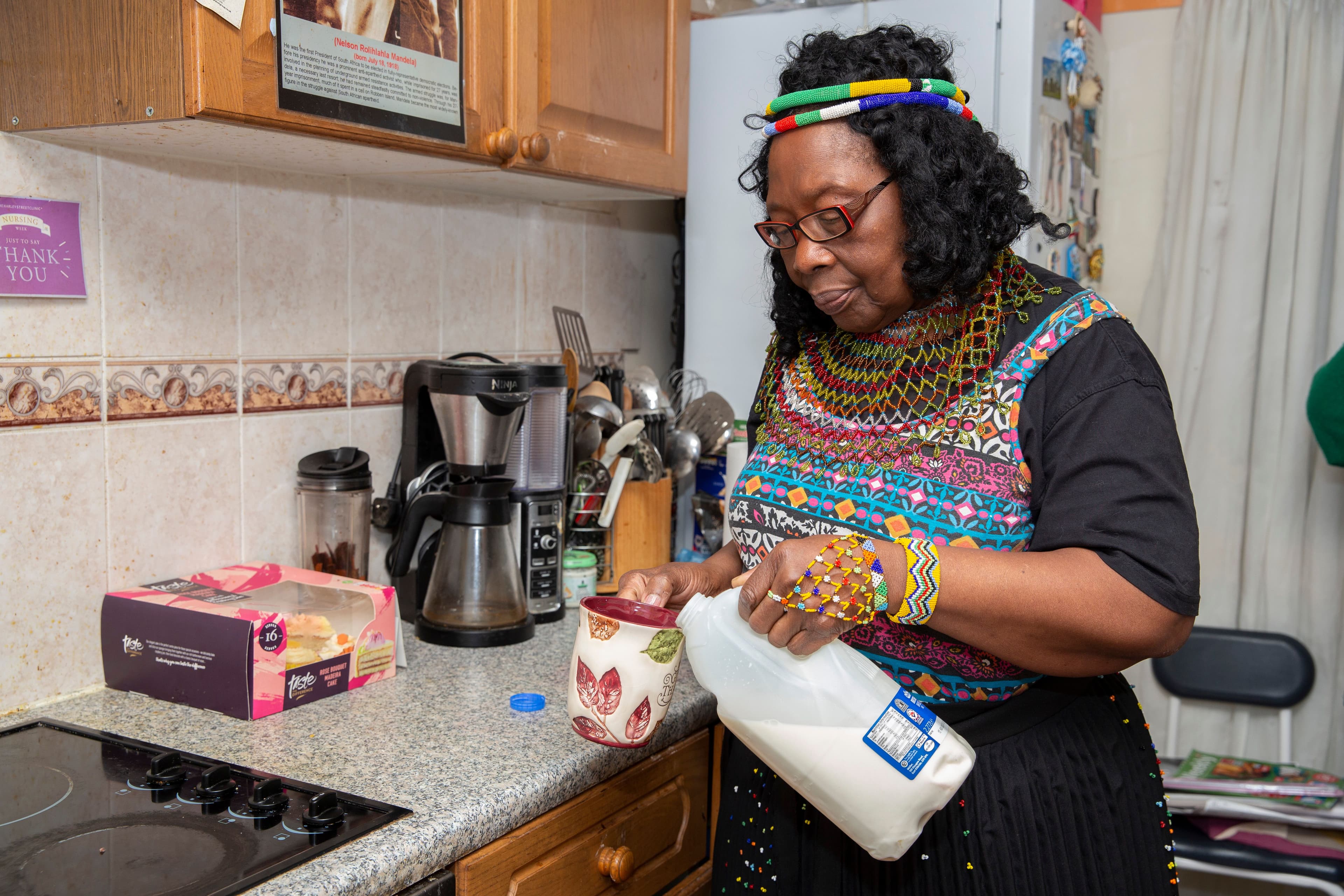 Older woman making a cup of tea