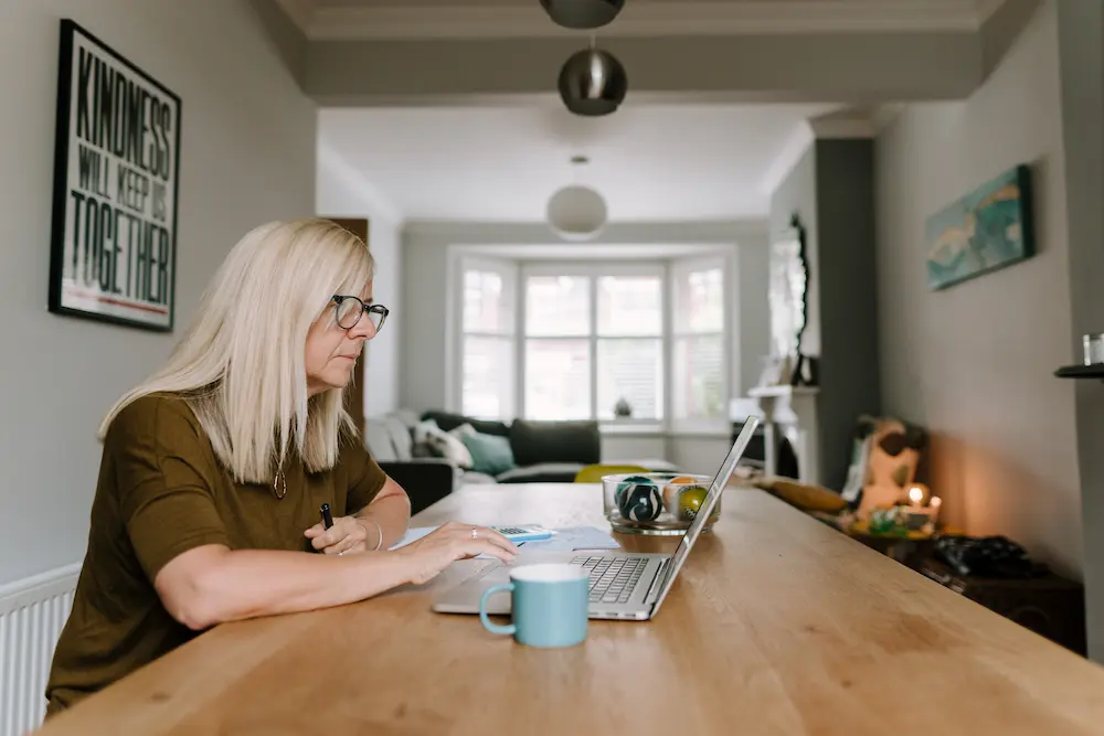 Older woman working on a laptop