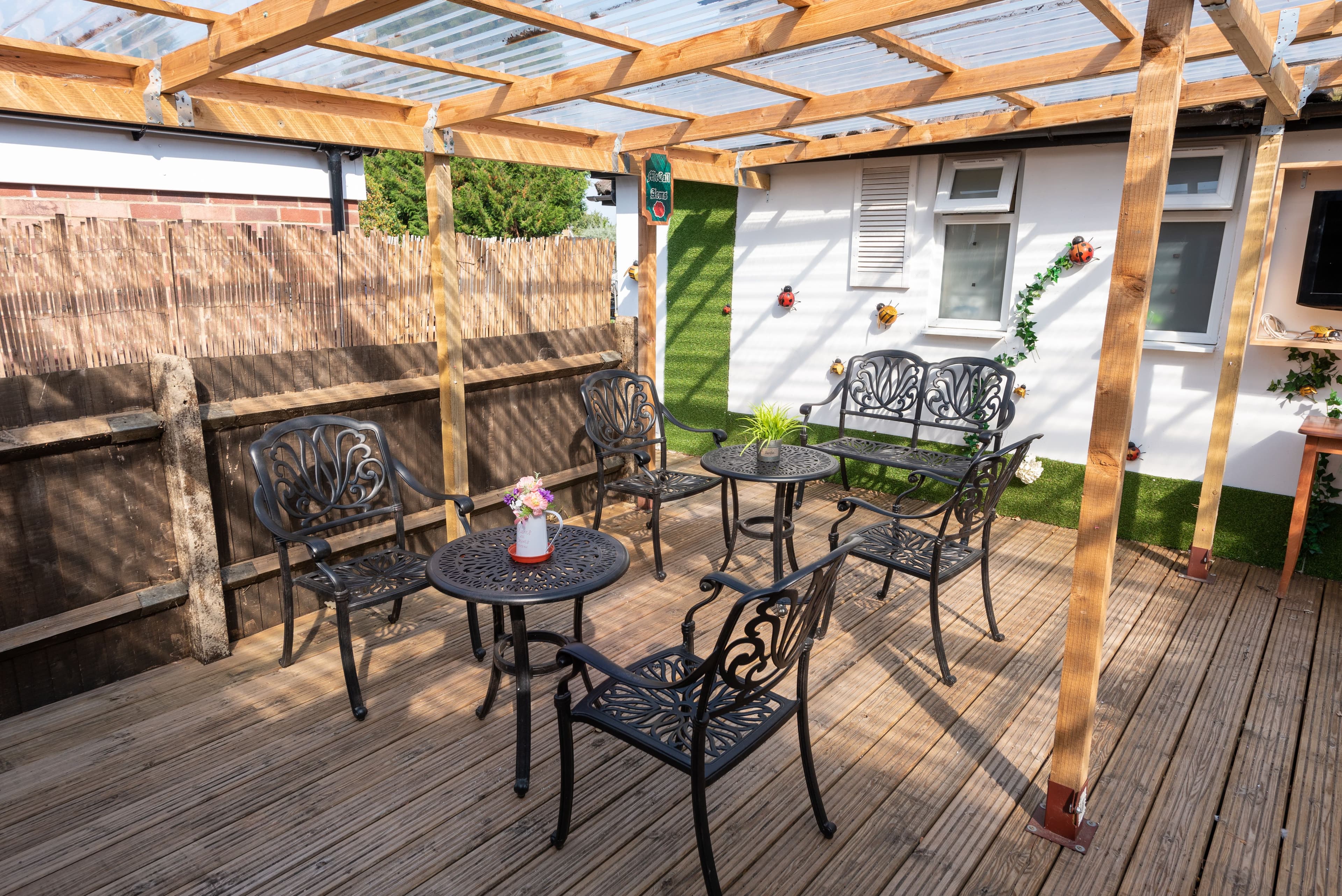 Garden seating area of Pinehurst care home in Crowthorne, Berkshire