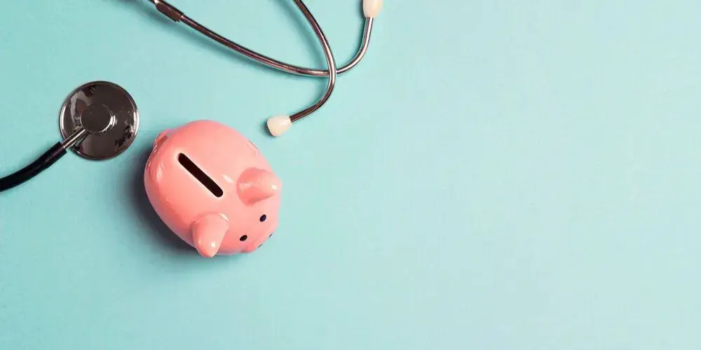 Piggy bank and stethoscope