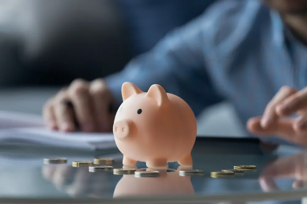 Piggy bank surrounded by coins