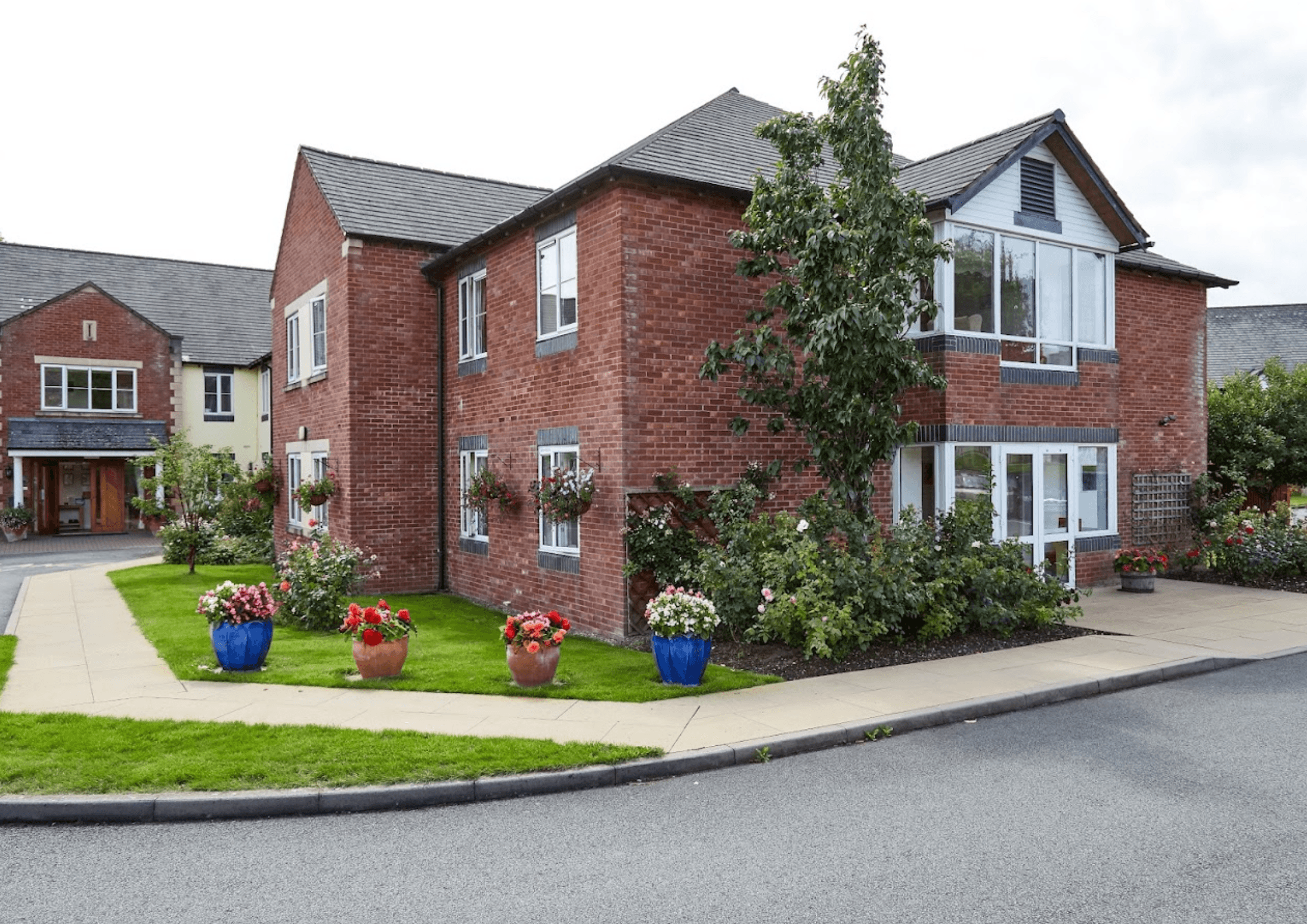 Exterior of The Rhallt care home in Welshpool, Wales