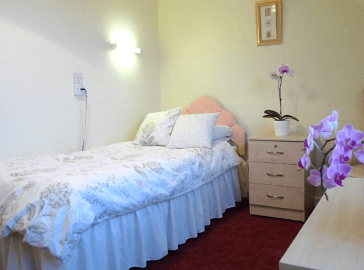 Bedroom of The Newton Grange care home in Langland, Wales
