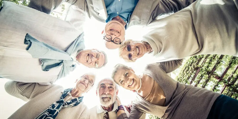 Several elderly people on a social outing