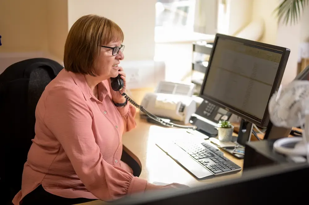 Woman over 50 at work using a computer