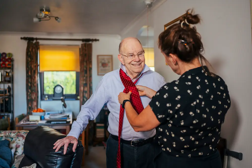 Women caring for older man