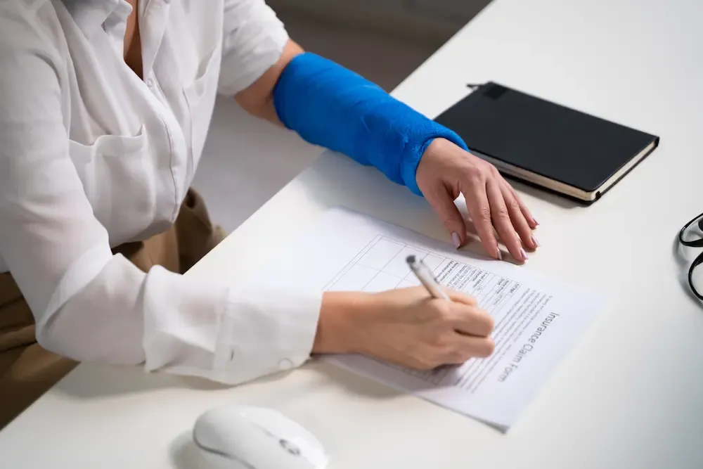 Worker filling out a benefit form