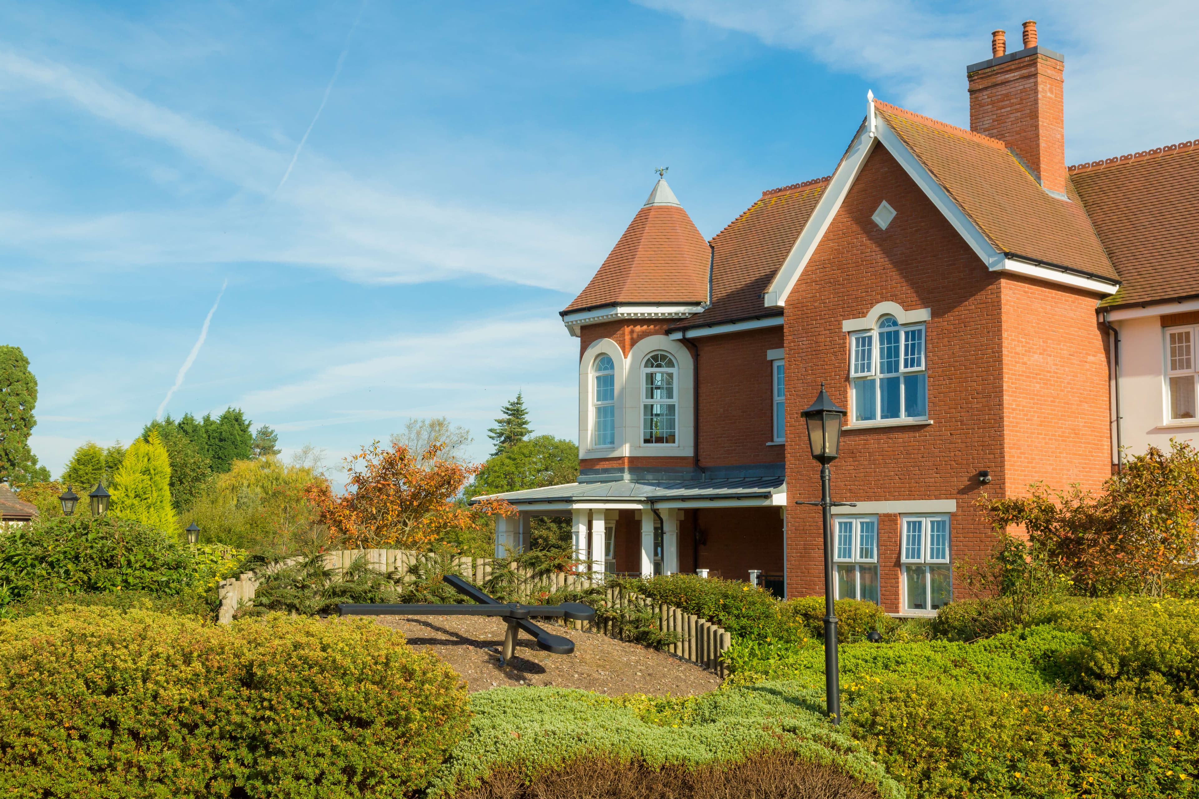 Exterior photo and garden at Foxland Grange Care Home in Wolverhampton