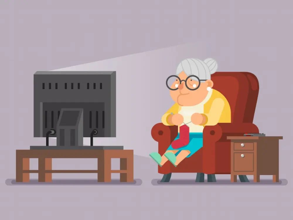 An elderly person watching TV