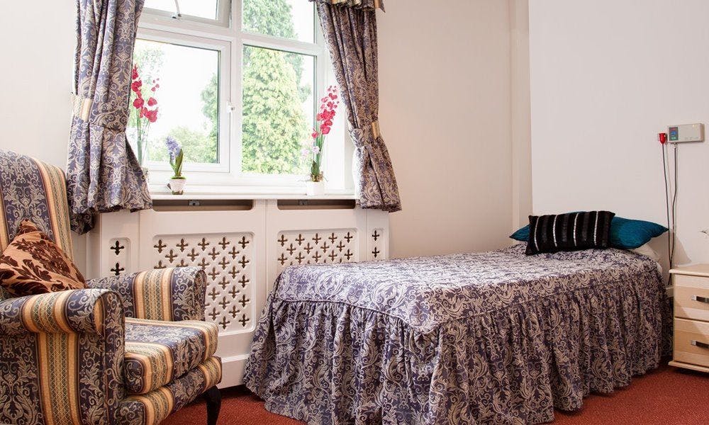 Bedroom at Surrey Hills Care Home in Godalming, Surrey