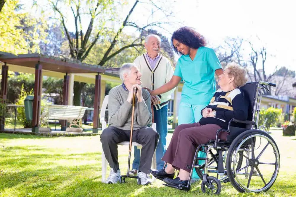 Care home residents and a carer
