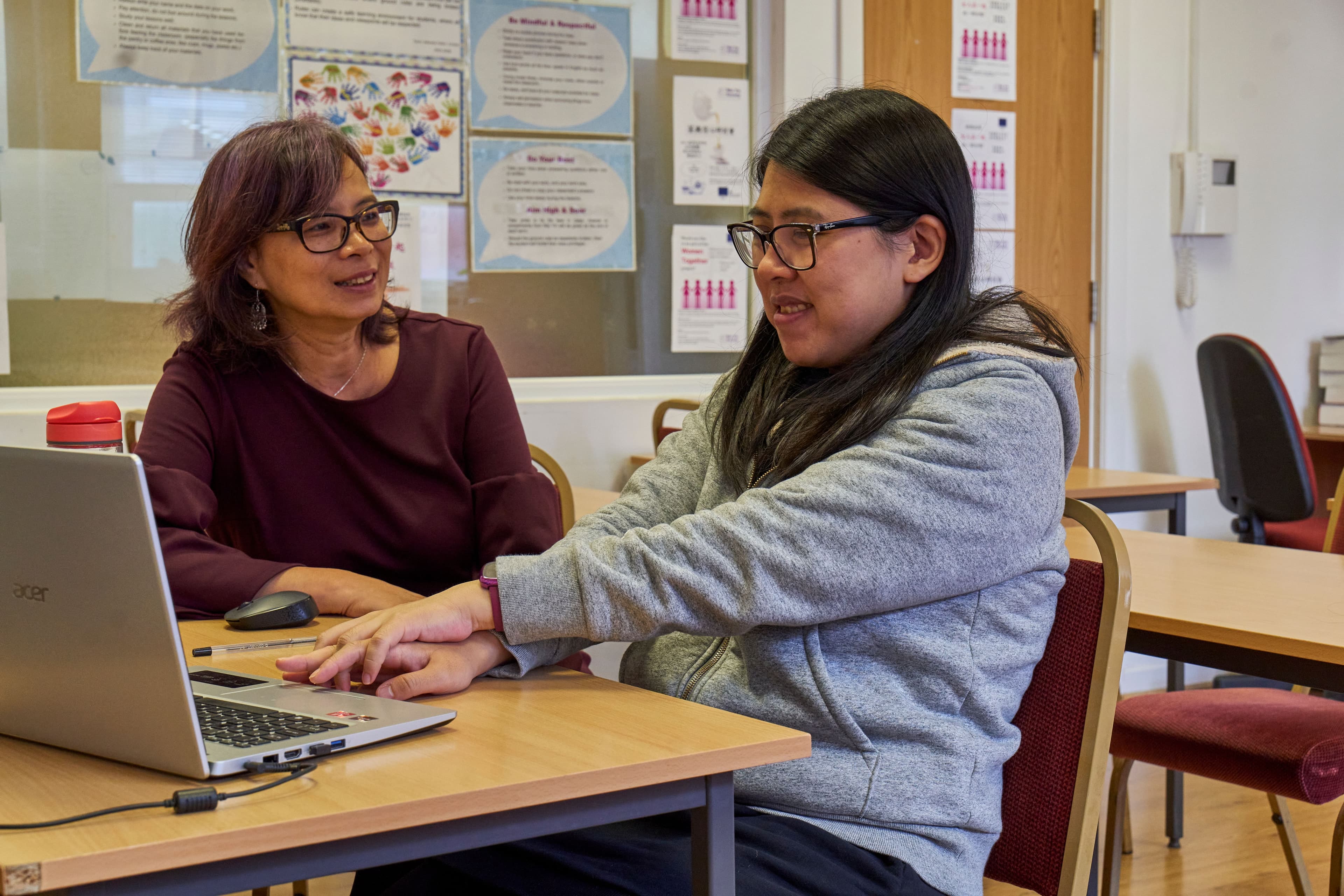 Female carers providing each other with emotional support