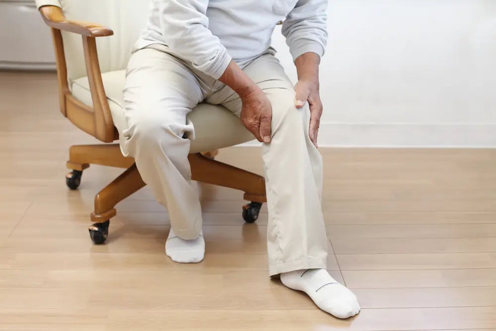 Older adult with knee pain