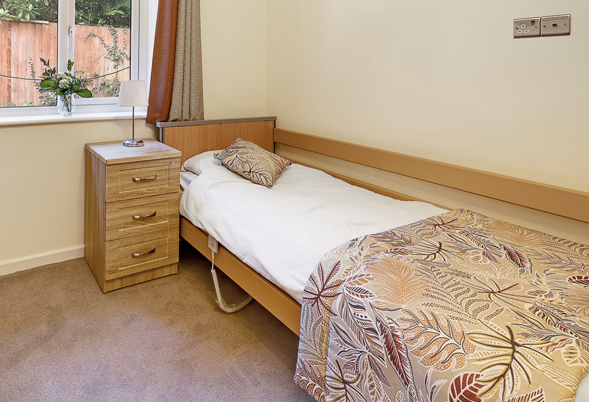 Bedroom of The Laurels and Pine Lodge Care Home in Poole, Dorset