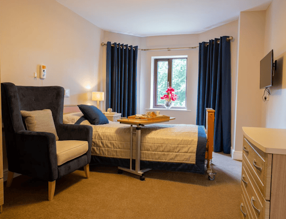 Bedroom of Woodend care home in Altrincham, Manchester