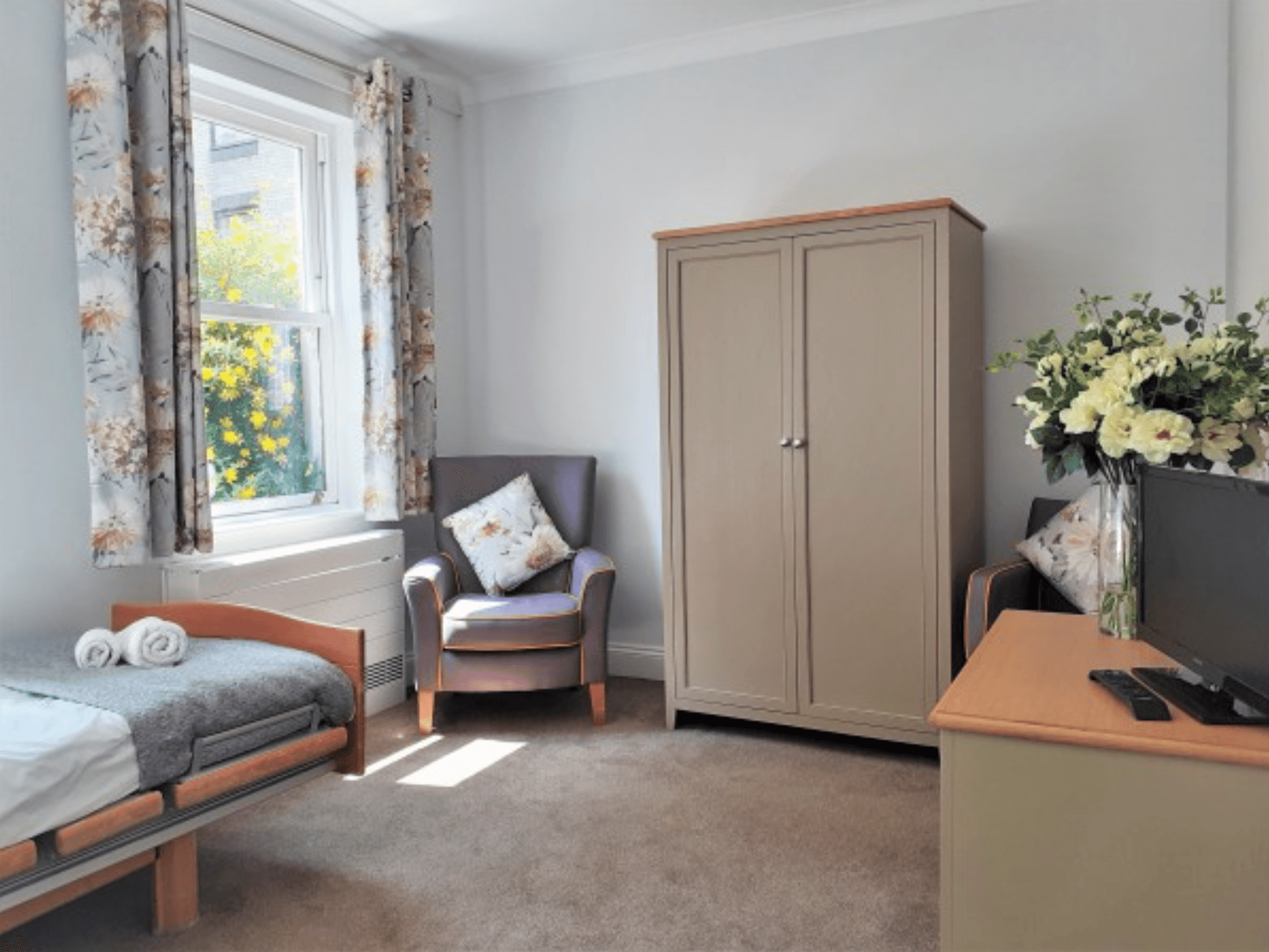 BEdroom of Somerleigh Court care home in Dorchester