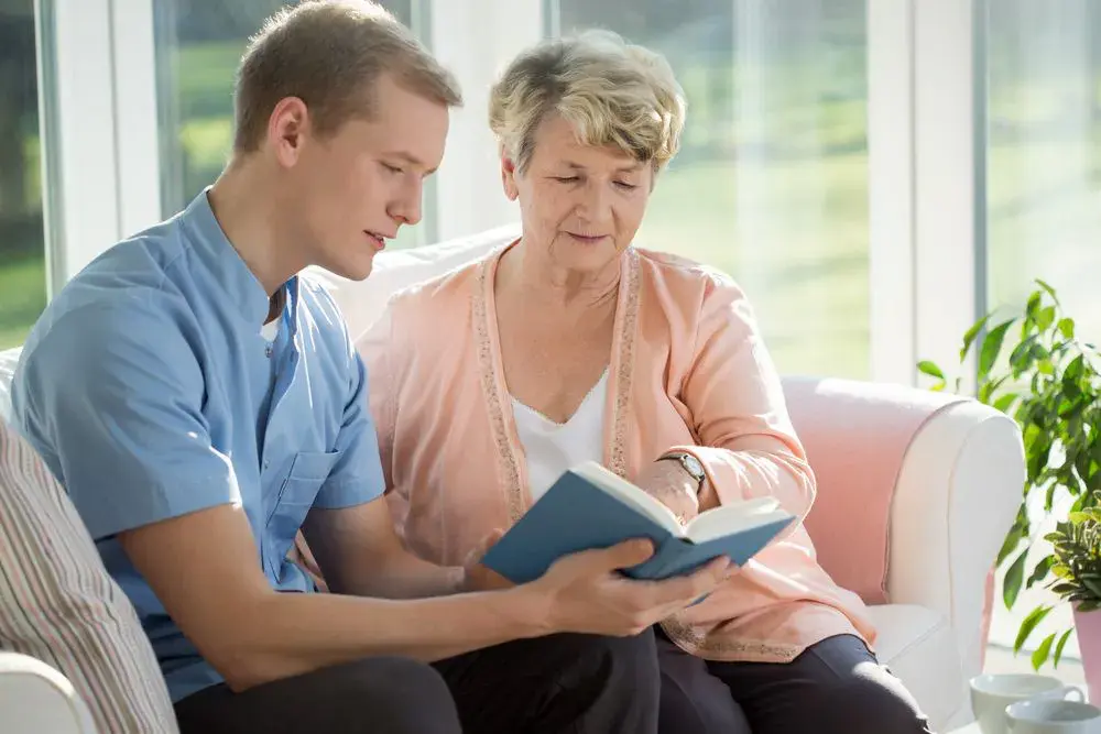 Young carer with an elderly female resident with dementia