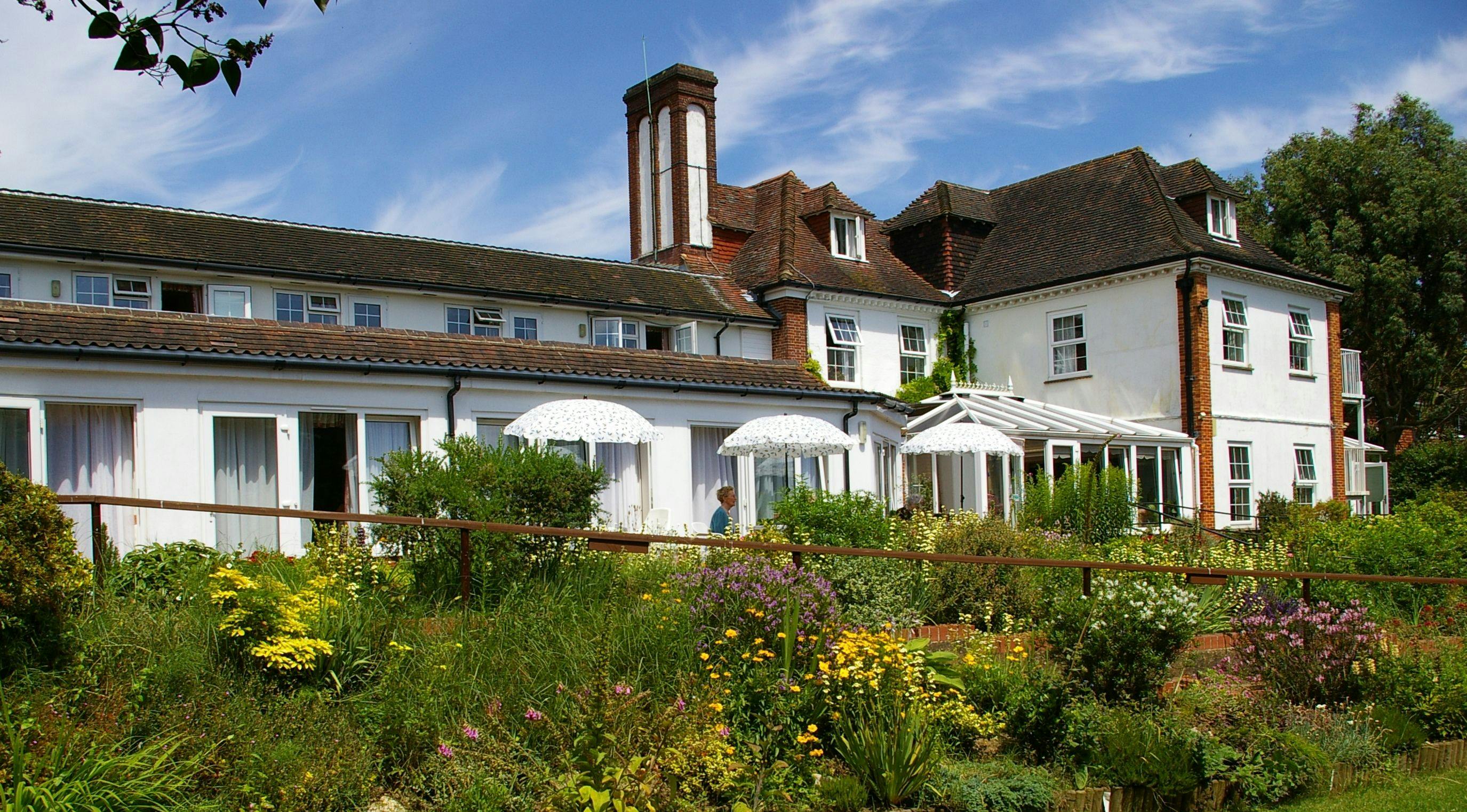 Exterior of Downs House Care Home in Petersfield, Hampshire