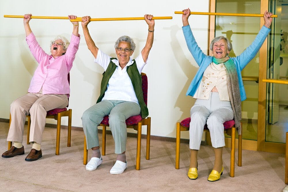 Three elderly ladies exercising 