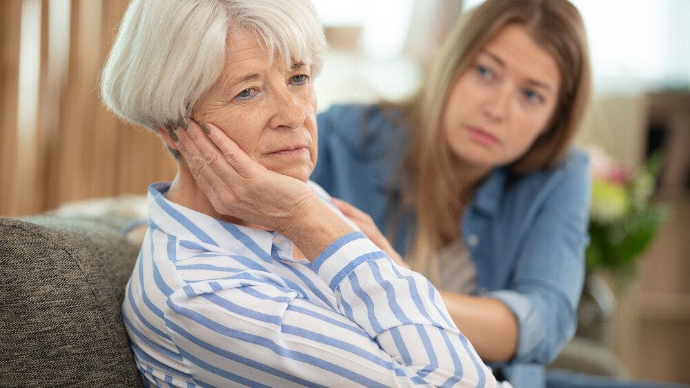 A woman talking to her elderly mum