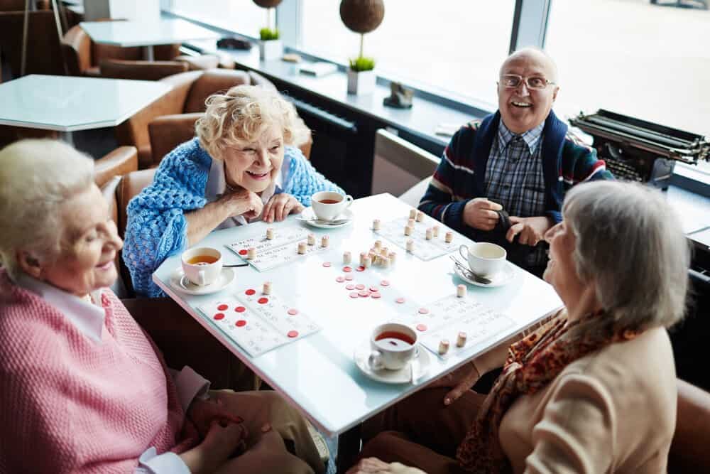 Four elderly people playing games