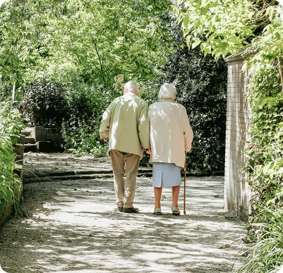 An old couple walking outside
